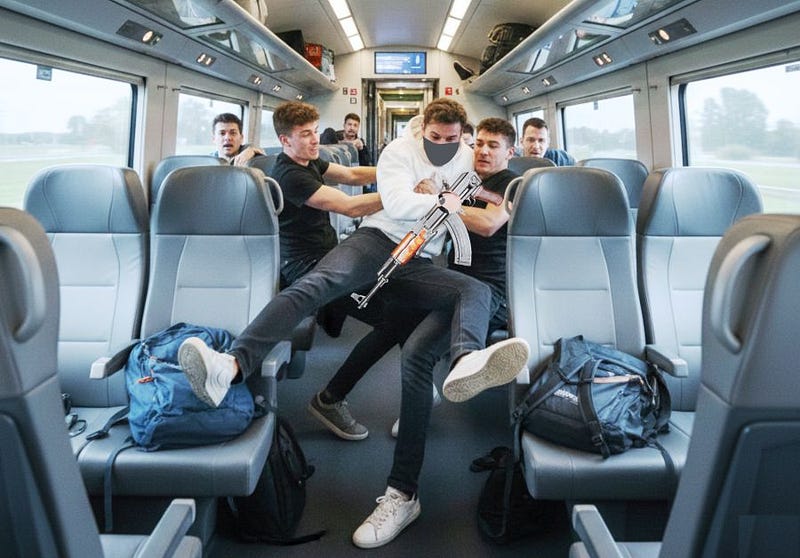 AI image generated my nano banana showing heroes disarming an AK 47-wielding terrorist on the Amsterdam to Paris train