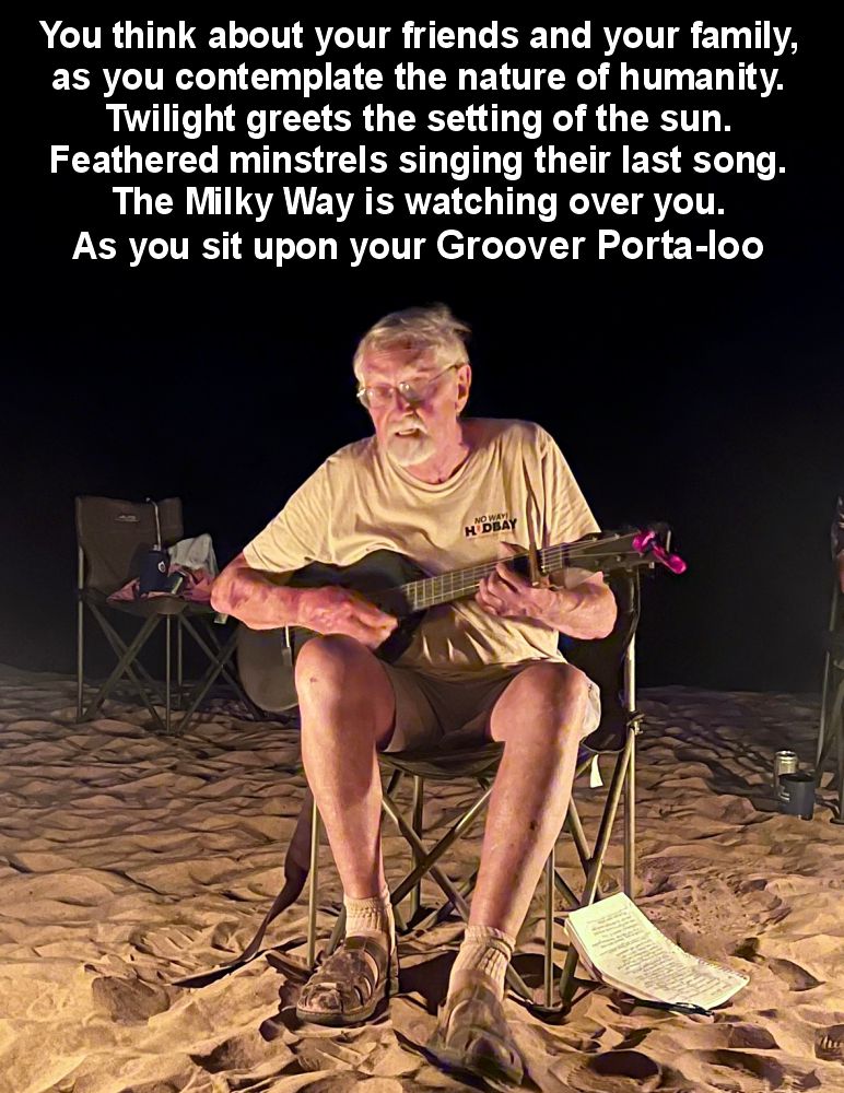 John Wakefield playing guitar on the banks of the Colorado River (image by the author)